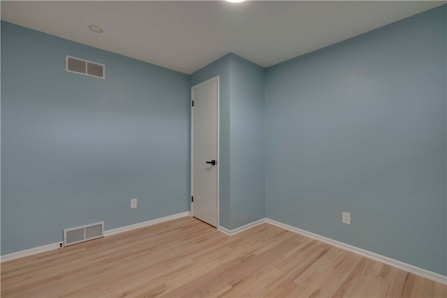 spare room featuring light hardwood / wood-style flooring