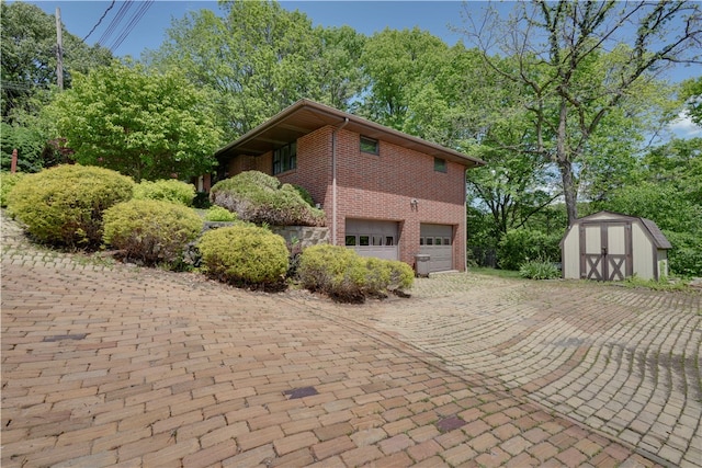 view of property exterior featuring a garage and a storage unit