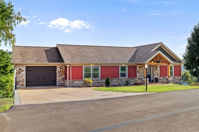 view of front of property featuring covered porch and a garage