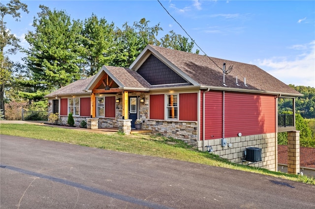 view of front of property with covered porch and a front yard