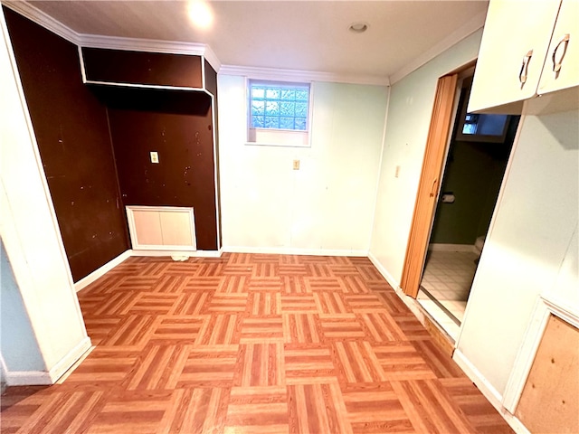 basement with parquet floors and crown molding