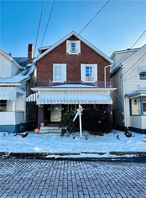 view of snow covered house