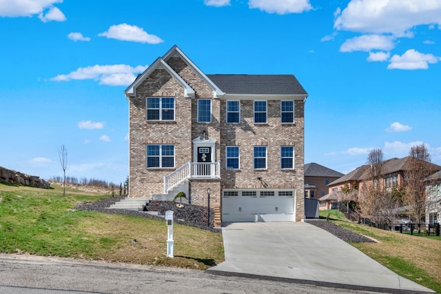 view of front of property with a garage and a front lawn