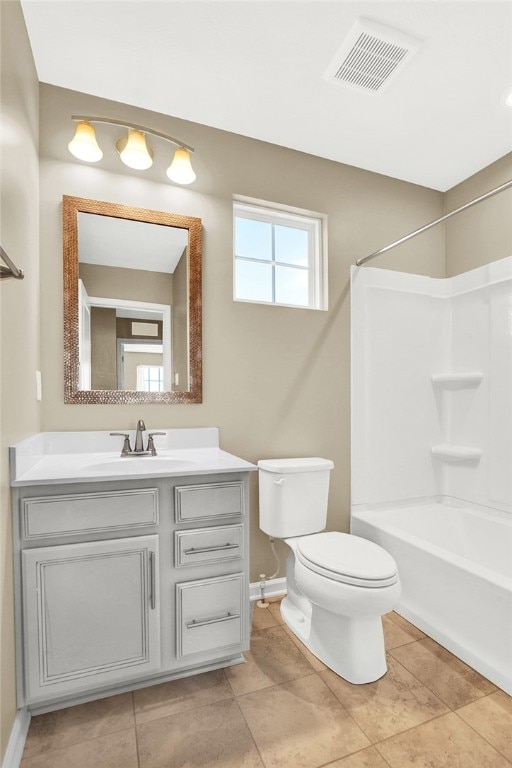 full bathroom featuring tile patterned flooring, vanity, toilet, and shower / bath combination