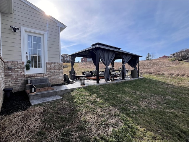 view of yard featuring a patio area and a gazebo