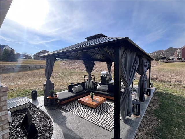 view of patio / terrace featuring an outdoor living space, grilling area, and a gazebo