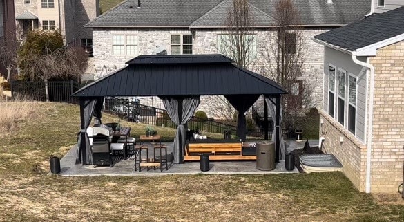 surrounding community with a gazebo, a lawn, and a patio area