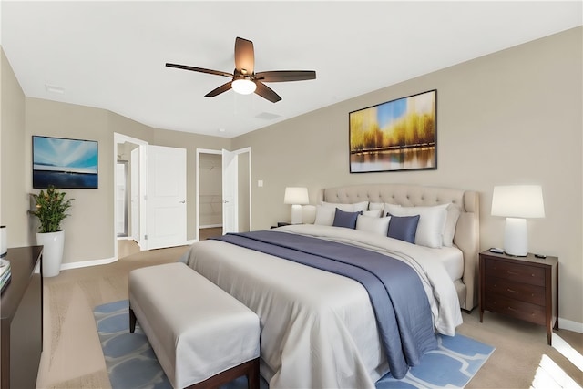 bedroom featuring light colored carpet and ceiling fan