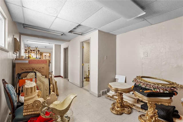 miscellaneous room featuring a paneled ceiling