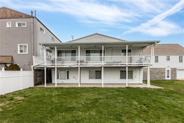 back of house with a yard and a patio area