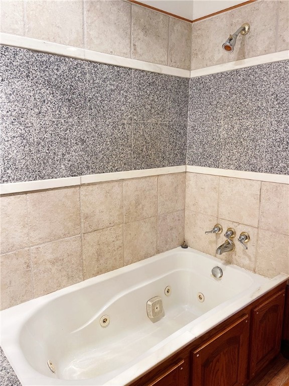 bathroom with shower / bathtub combination and tile walls