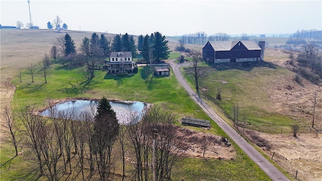 drone / aerial view featuring a rural view and a water view