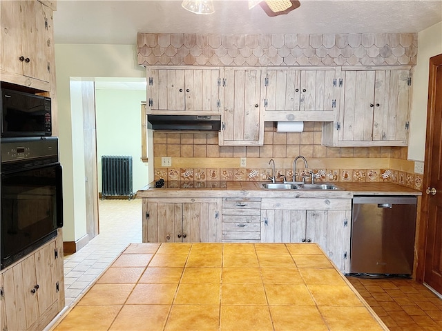 kitchen featuring backsplash, radiator, light tile floors, and black appliances