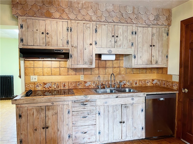 kitchen featuring stainless steel dishwasher, black electric cooktop, tasteful backsplash, radiator, and sink