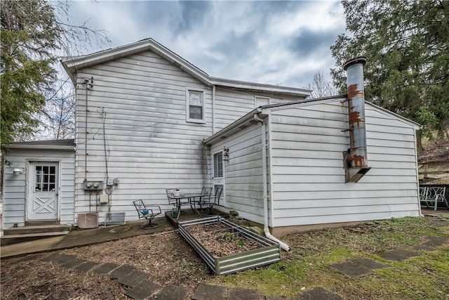 back of house featuring a patio area