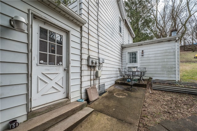 entrance to property featuring a patio area