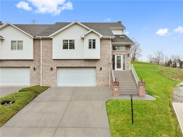 view of front of home featuring a garage and a front lawn