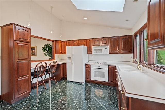 kitchen featuring a skylight, dark tile patterned floors, white appliances, sink, and high vaulted ceiling