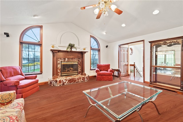 living room with hardwood / wood-style floors, plenty of natural light, and vaulted ceiling