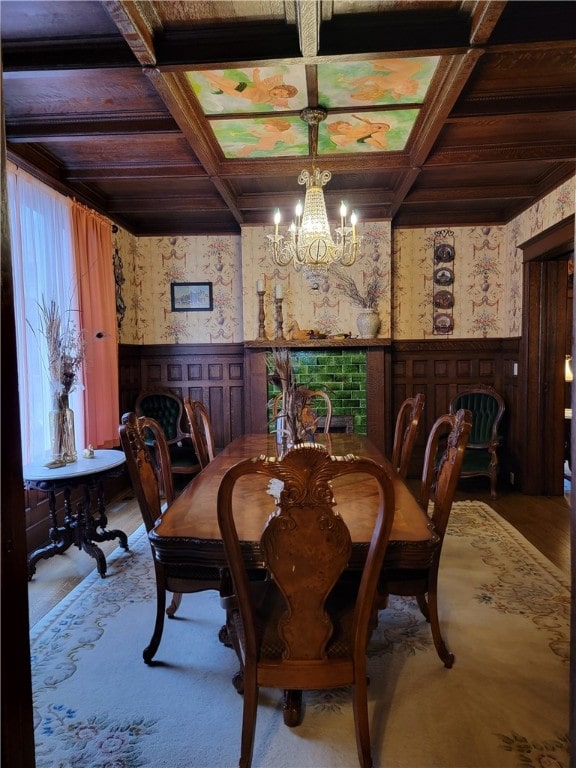 dining room featuring an inviting chandelier, beam ceiling, and coffered ceiling