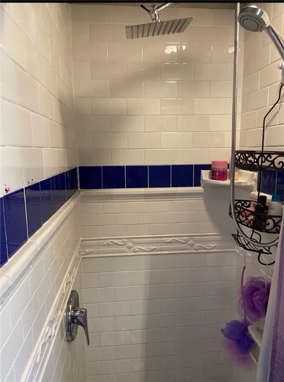 bathroom with a tile shower