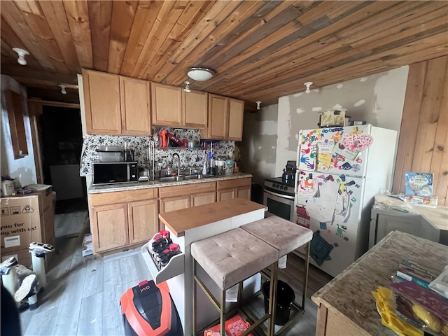 kitchen with dark wood-type flooring, white fridge, backsplash, sink, and wooden ceiling