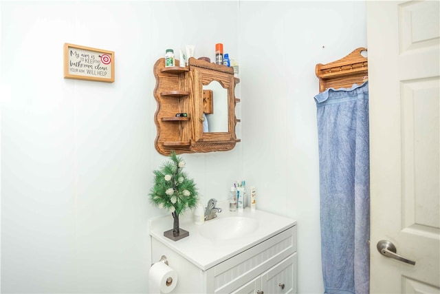 bathroom with vanity with extensive cabinet space