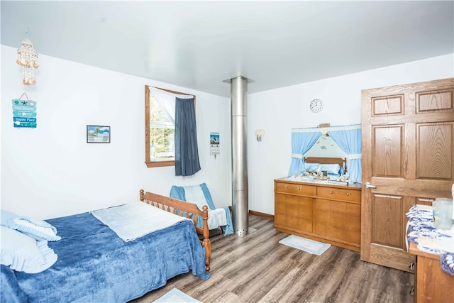 bedroom with hardwood / wood-style floors