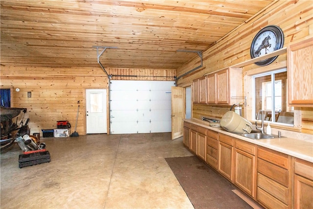 garage featuring wooden ceiling, wooden walls, and sink