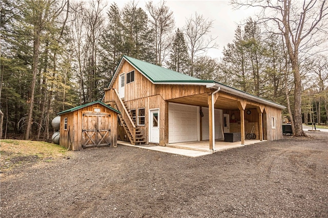 view of horse barn with an outdoor structure