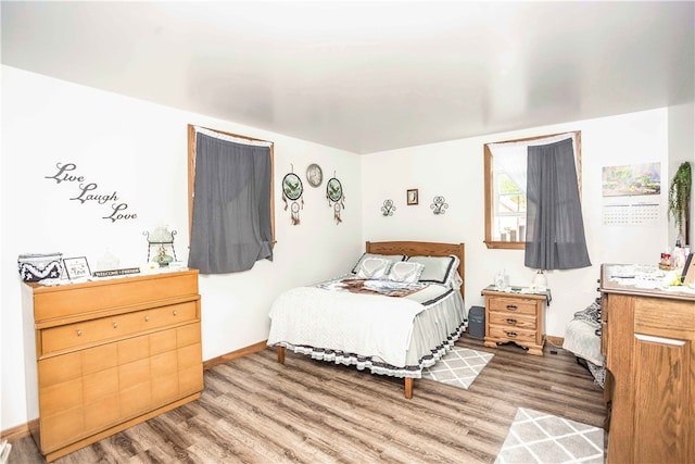 bedroom featuring wood-type flooring