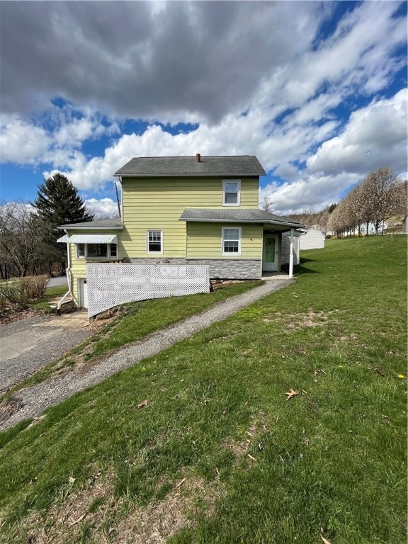 view of side of property with a yard