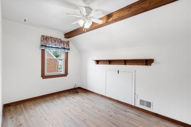 additional living space featuring ceiling fan, vaulted ceiling with beams, and light wood-type flooring