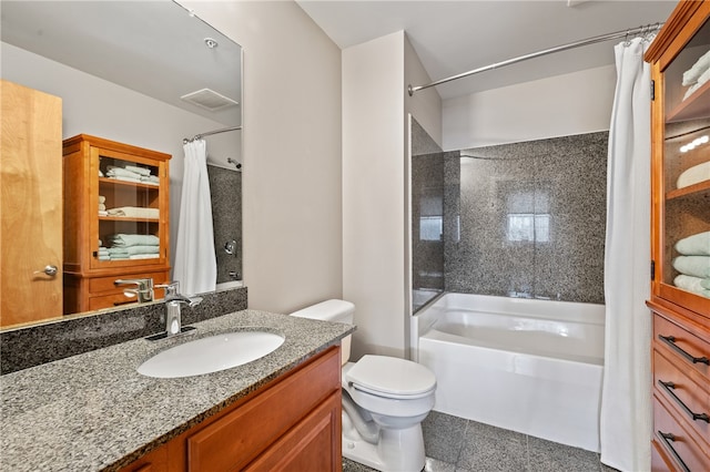 full bathroom with tile flooring, shower / bath combo with shower curtain, toilet, and vanity with extensive cabinet space