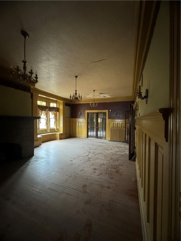 misc room with an inviting chandelier and dark hardwood / wood-style floors