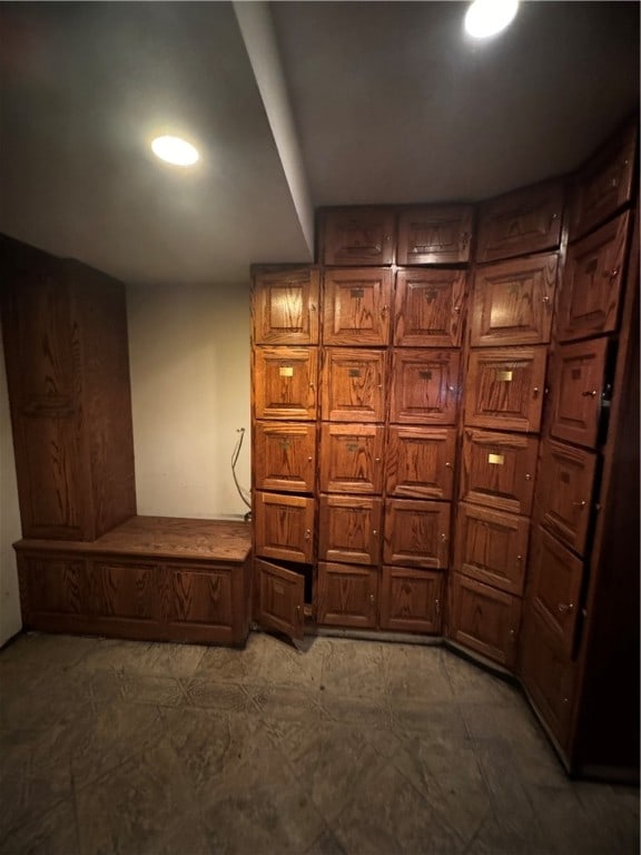 interior space featuring dark tile flooring