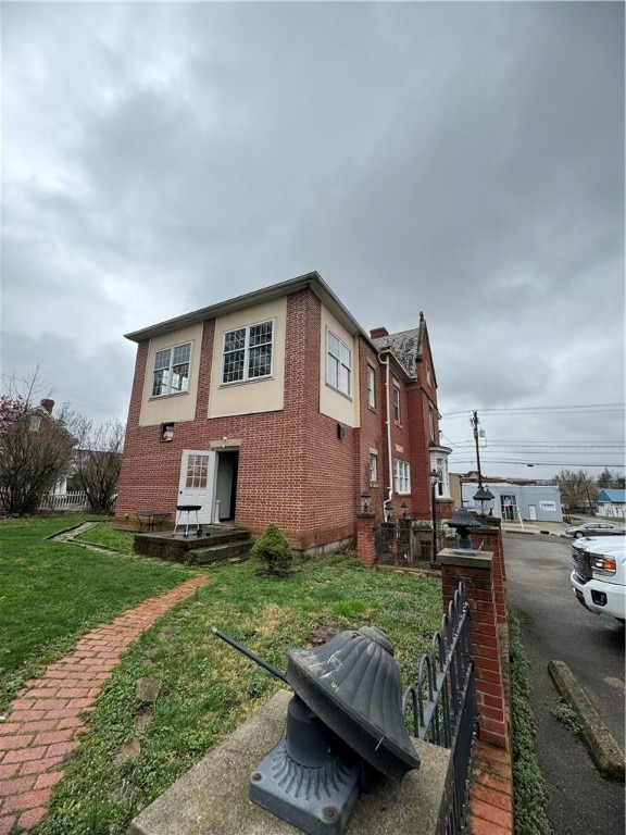 view of home's exterior featuring a lawn