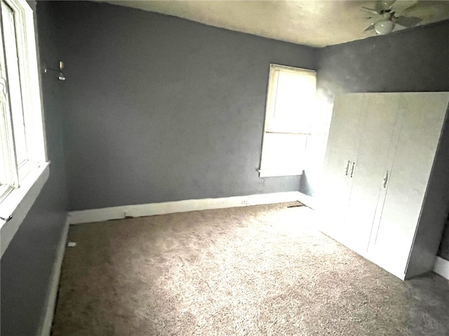 empty room featuring ceiling fan