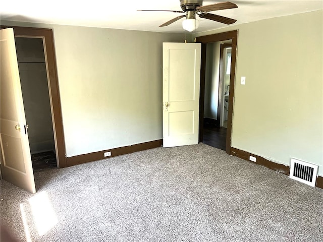 unfurnished bedroom with carpet, a closet, and ceiling fan