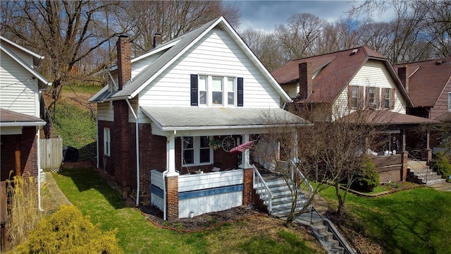 bungalow featuring a front yard