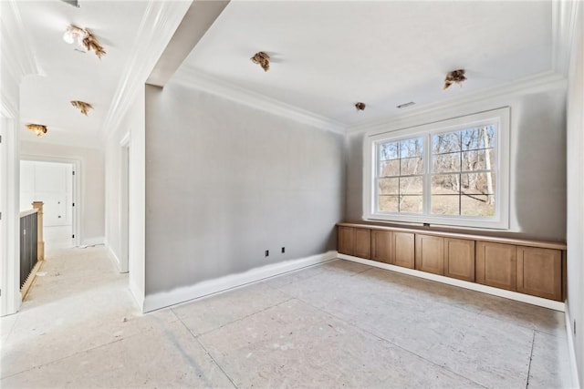 unfurnished room featuring crown molding