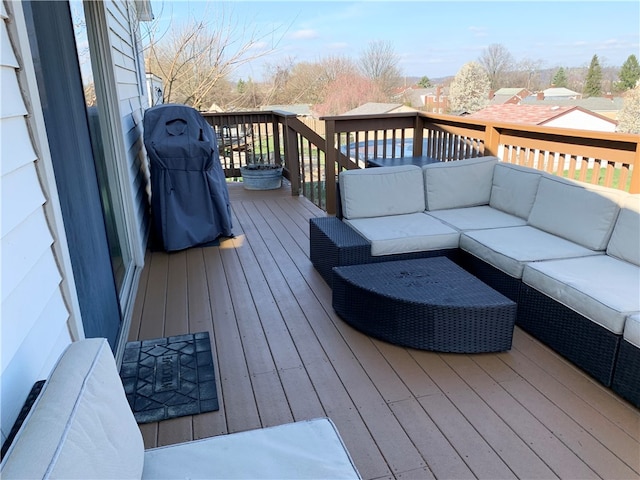 wooden deck with an outdoor living space