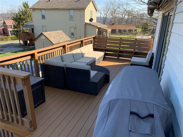 wooden terrace featuring outdoor lounge area