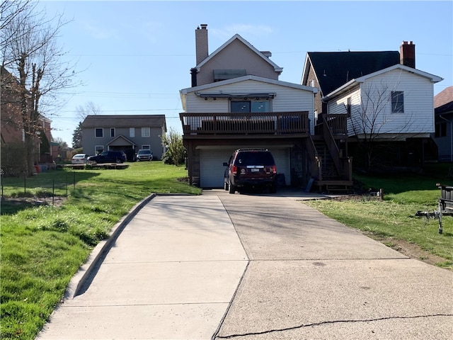 view of front facade with a front yard and a garage