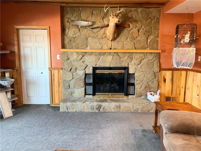 living room featuring carpet and a fireplace