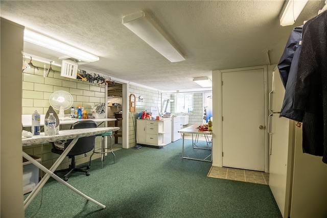 interior space featuring a textured ceiling and dark carpet