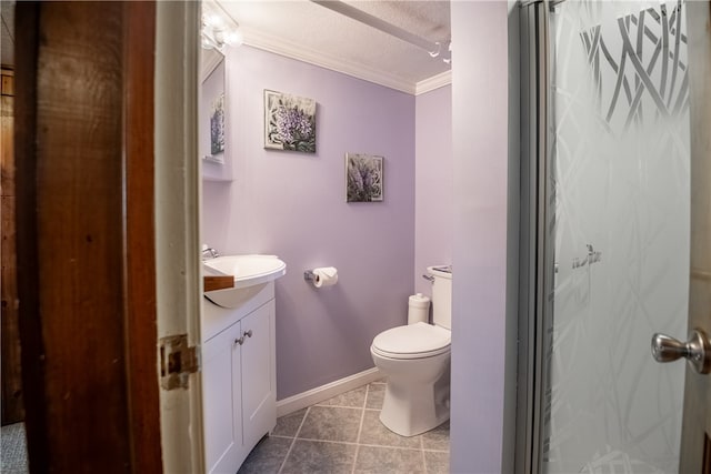 bathroom featuring tile floors, a textured ceiling, toilet, vanity, and ornamental molding