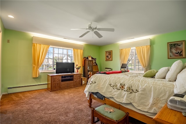 carpeted bedroom featuring ceiling fan, a baseboard radiator, and multiple windows