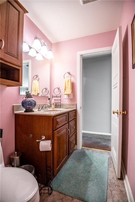 bathroom featuring vanity and tile floors