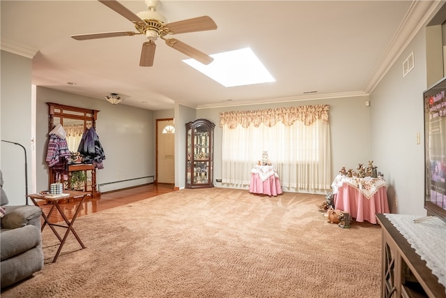 recreation room featuring a baseboard heating unit, ceiling fan, and ornamental molding